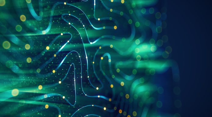 Abstract digital background featuring flowing blue and green lines with glowing yellow particles, evoking a sense of data flow or neural networks.