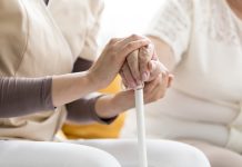 Woman comforting senior