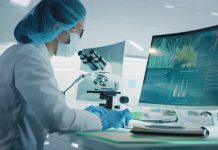 Female scientist testing medical marijuana. Charts and models on computer screens. Modern laboratory interior