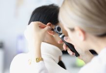 ENT doctor examining patient