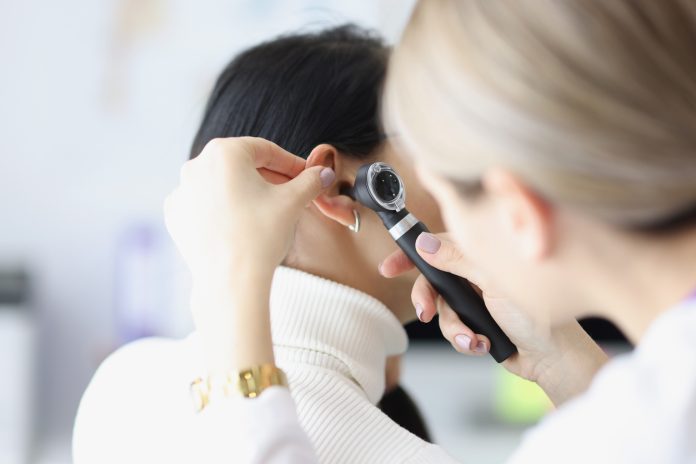 ENT doctor examining patient
