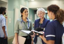 NHS administrator with medical team