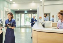 senior nurse chatting to hospital doctor