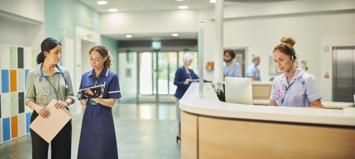 senior nurse chatting to hospital doctor