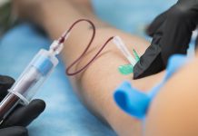 Nurse taking blood samples in hospital