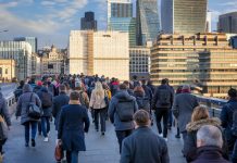 Crowds of commuters on London Bridge rushing into the City