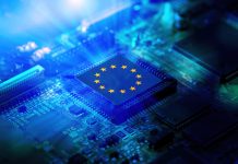 EU flag on a CPU processor. European chip manufacturer, GPU microchip on a motherboard.
