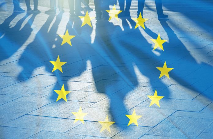 EU Flag and shadows of People concept picture