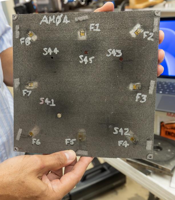 Southwest Research Institute (SwRI) has developed and tested a micrometeoroid and orbital debris (MMOD) detection and characterization system that detects when a satellite or spacecraft experiences an impact. The test article pictured was equipped with the MMOD detection and characterization system and struck with debris fired from SwRI’s light gas gun to simulate orbital impact scenarios. Credit© Southwest Research Institute