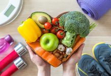 Healthy lifestyle on ketogenic diet, eating clean keto food good health dietary in heart dish with aerobic body exercise, gym workout training class , weight scale and sports shoes in fitness center