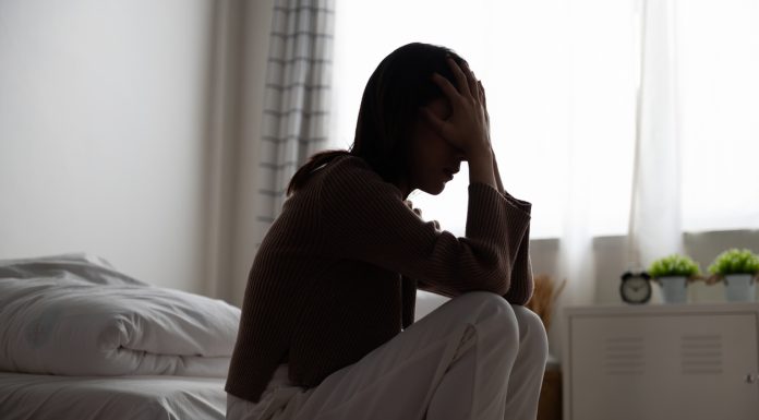 Close up young Asian woman feeling upset, sad, unhappy or disappoint crying lonely in her room. Woman health mental problem concept.