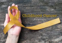 Childhood cancer awareness gold ribbon bow color on helping hand for Alveolar Rhabdomyosarcoma, Embryonal Rhabdomyosarcoma, Neuroblastoma & Osteosarcoma awareness
