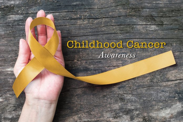 Childhood cancer awareness gold ribbon bow color on helping hand for Alveolar Rhabdomyosarcoma, Embryonal Rhabdomyosarcoma, Neuroblastoma & Osteosarcoma awareness