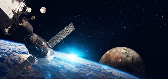 Space station on orbit of the Earth planet and universe background.