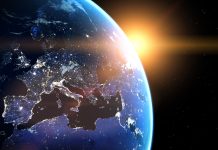 Planet Earth viewed from space with glowing city lights. Europe view. World with shine sunrise from the space.