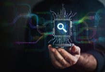 Search in your hand. A hand holds digital lens icon in the center and circuit board with vibrant data transfers, representing evolving search technology of the future.