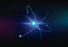 A vibrant illustration of a glowing atomic structure with electron orbits on a dark background, symbolizing concepts in quantum physics, energy, and scientific research.