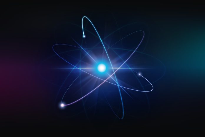 A vibrant illustration of a glowing atomic structure with electron orbits on a dark background, symbolizing concepts in quantum physics, energy, and scientific research.