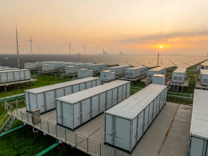 Energy storage power station, solar power station and wind power station at sunrise