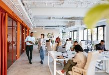 Modern Collaborative Office Space with Diverse Professionals Working in a Co-Working Environment