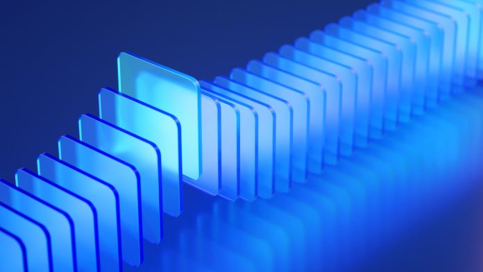 Brightly illuminated transparent blue acrylic panels are showcased in a modern and clean composition, emphasizing design and innovation.