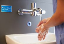 Close Up Of Medical Staff Washing Hands