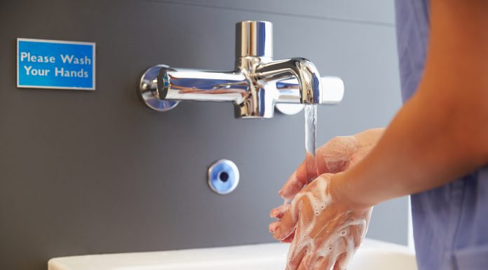 Close Up Of Medical Staff Washing Hands
