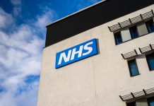 Warrington, United Kingdom - March 6, 2016: Warrington, UK - march 6, 2016: View of the NHS (National Health Service) logo at the Springfields Medical Centre in the centre of Warrington, Cheshire.