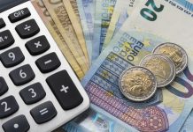 Close up of a calculator and euro money in a financial analyzing concept