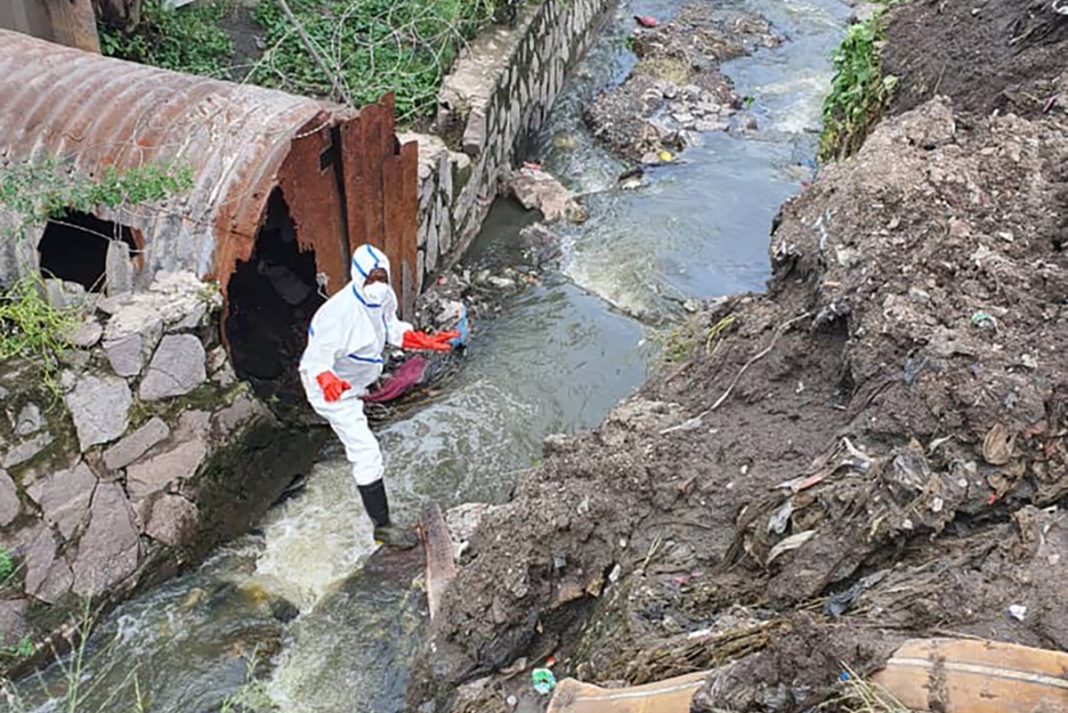 An urban wastewater sampling point is located in Pakadjuma, Kinshasa. The surrounding environment is characterised by intense commercial activity, particularly food sales, small-scale trade, and informal waste discharge, which makes this location a strategic sentinel point for pathogen surveillance.