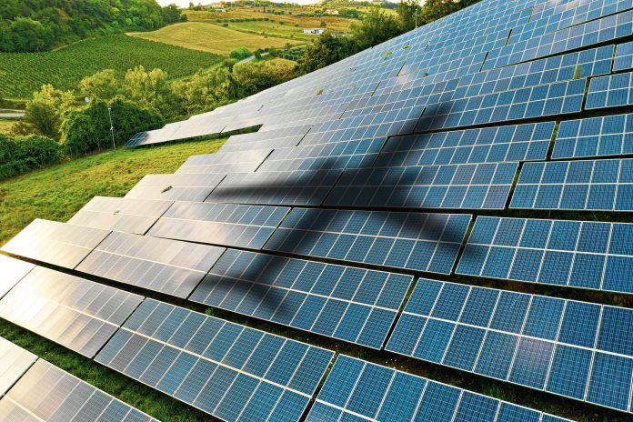 Airplane shape against solar panels