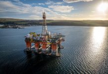 A drilling rig and platform used in the oil and gas industry for offshore fuel exploration