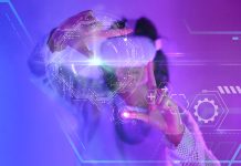 Close-up of fingers touching holograms on digital virtual screen