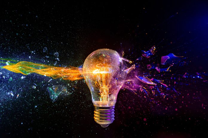 Exploding light bulb with colorful fragment splash