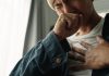 Young asian man was suffering from painful chest pain from a chronic disease.