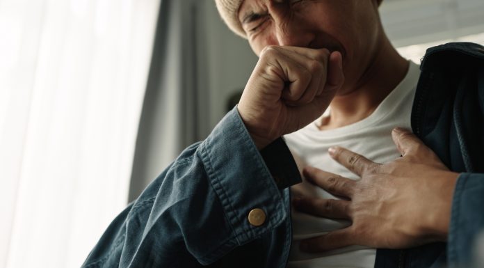 Young asian man was suffering from painful chest pain from a chronic disease.