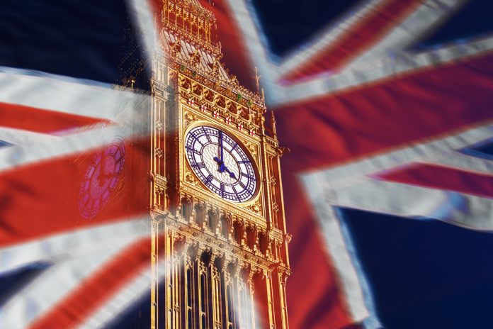 Composite image of Big Ben and the the British Union Jack Flag, Westminster, London.