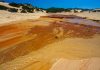 The heavily polluted Irvi River, which carries highly toxic heavy metals from the abandoned Montevecchio mine to the Spiaggia di Piscinas beach, Sardinia, Italy