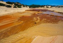The heavily polluted Irvi River, which carries highly toxic heavy metals from the abandoned Montevecchio mine to the Spiaggia di Piscinas beach, Sardinia, Italy