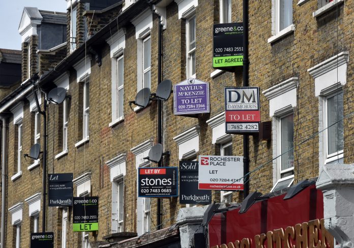 To Let Signs London, UK -April 10th 2016: Commercial real estate rental signs attached to the wall of apartments To Let in the Camden, Mansfield Road NW3