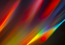 2024 Photonics breakthroughs: Microresonators advance electron-photon control Colorful light beams as a background