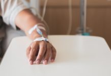 New drug targets tumour defences and reverses chemotherapy resistance Calm patient got medicine injection on left hand during admission and medical operation in hospital.