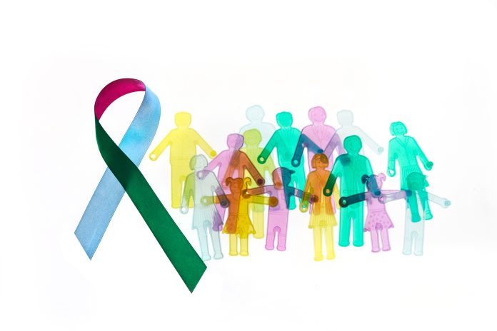 Rare Disease Day Background. Colorful awareness ribbon with group of people with rare diseases.