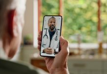 Man, cellphone screen and telehealth with doctor or online consultation at home or virtual advice, discussion or diagnosis. Patient, healthcare worker and internet conversation, service or futuristic
