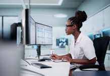 NHS ESR transformation faces key accounting officer assessment Hospital Doctor Using Spreadsheet For Billing Codes On Desktop