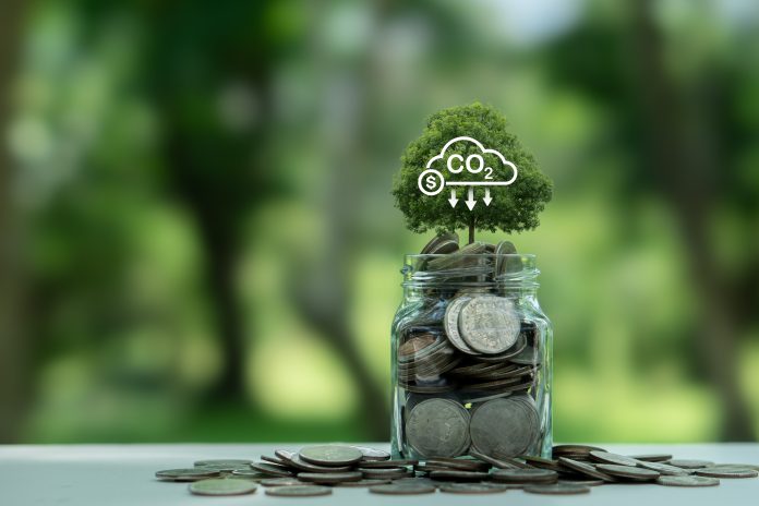 CO2 tax, Carbon credit. Tree on money with co2 icon on green background. environmental and social responsibility business concept. Taxation for nature pollution. Controlling carbon emission