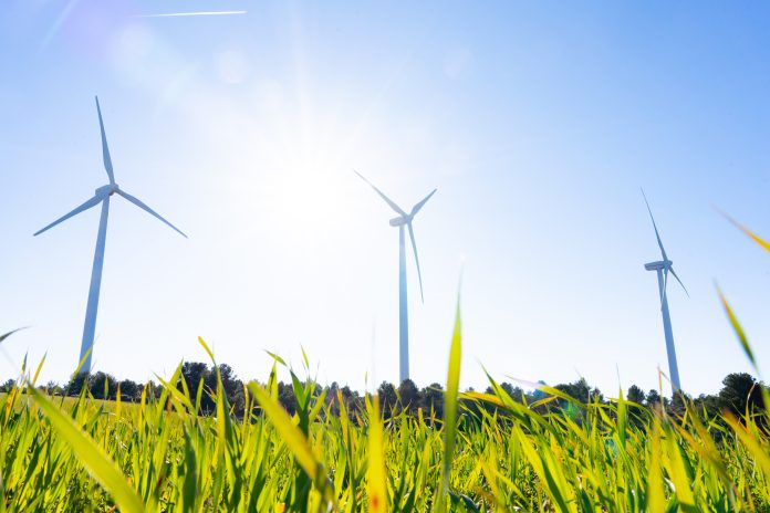 Wind turbines generating renewable energy at Serra of Rubió wind farm in Barcelona, Spain, symbolizing sustainable power and a cleaner future.