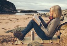 Senior woman on the beach at Gruinard Bay, Ross and Cromarty, Scotland. Off season, beach all to herself.