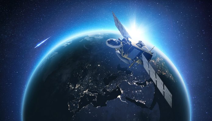 Amazing beautiful blue planet earth with satellite at sunset view from space. Horizon Earth with the lights of night cities. Communication and Telecommunications. Broadcasting.