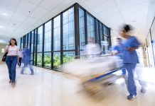 People rushing in a busy hospital